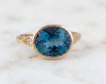 Oval London Blue Topaz Diamond Ring: 14K Yellow Gold Bezel Setting