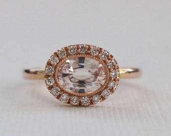 1.01 Ct. Oval Light Peach Sapphire Milgrain Bezel Halo Ring in 14K Rose Gold Design by Studio 1040