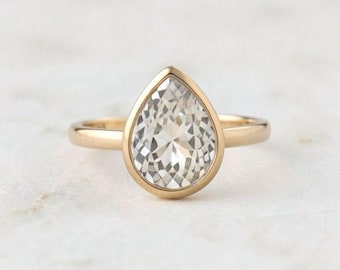 Pear Shaped White Sapphire Bezel Ring in 14K Gold
