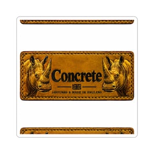 May include: A rectangular tan leather patch featuring embossed illustrations of two rhinoceroses facing inward. The centre text reads Concrete, with a small Union Jack icon and the text DESIGNED & MADE IN ENGLAND below it. Stitched edges.