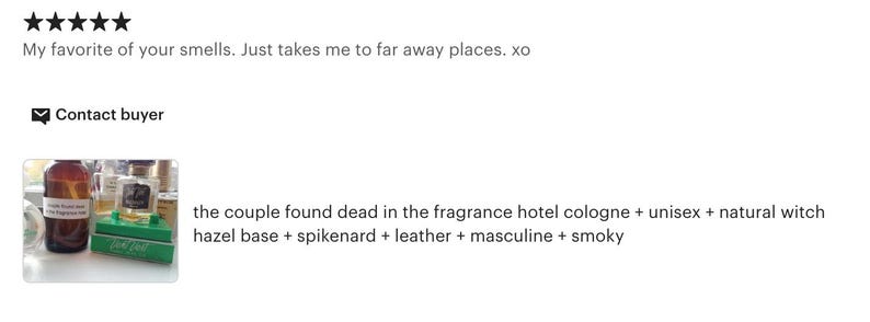 May include: A brown glass bottle with a white label, alongside other perfume bottles and green boxes. The text "the couple found dead in the fragrance hotel cologne + unisex + natural witch hazel base + spikenard + leather + masculine + smoky" is visible.