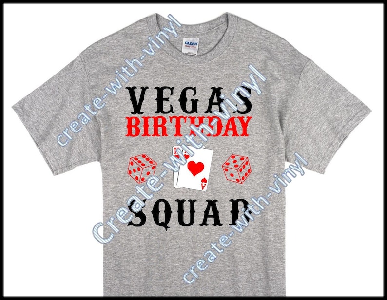 May include: Grey t-shirt with the text "VEGAS BIRTHDAY SQUAD" in black and red. The design includes a red playing card with a heart and two red dice.