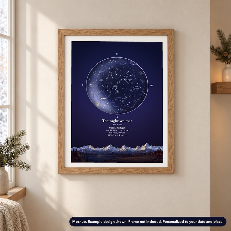 Mockup of a personalized painted-horizon star map poster shown in an oak frame in a winter setting. Frame not included.