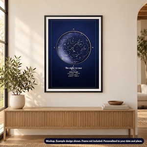 Mockup of a personalized star map poster, unframed, shown in a black frame on a wall. Frame not included.