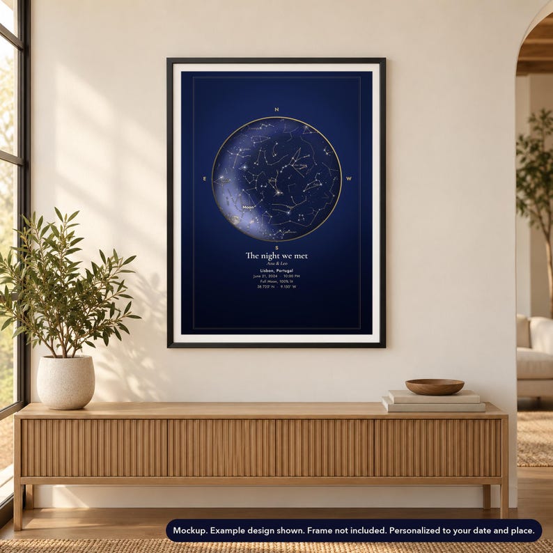 Mockup of a personalized star map poster, unframed, shown in a black frame on a wall. Frame not included.