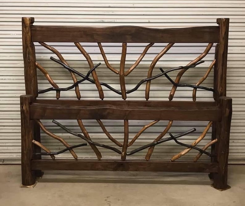 May include: A rustic wooden bed frame with a headboard featuring a unique design of interwoven branches. The branches are a mix of natural brown and black, creating a striking contrast against the dark wood.