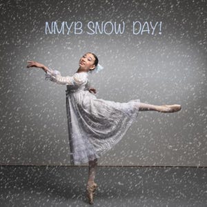 May include: A dancer in a white dress with long sleeves and a full skirt, wearing pointe shoes, performs a pose amidst falling snow. The text NMYB SNOW DAY! is displayed in light blue letters at the top against a dark gray background.