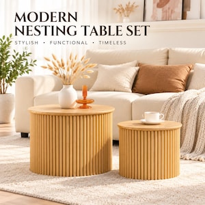 May include: A set of two round nesting tables featuring a light wood finish and a vertical slatted design. The text MODERN NESTING TABLE SET STYLISH FUNCTIONAL TIMELESS is visible at the top. The tables have flat circular tops and cylindrical bases.