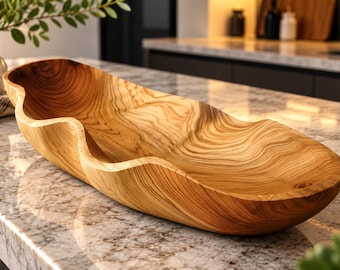 May include: An elongated, hand-carved wooden bowl featuring a natural light brown finish with prominent, swirling dark wood grain patterns. The bowl has a distinct, wavy, organic rim design that curves along its length, creating a smooth, hollowed-out interior surface.