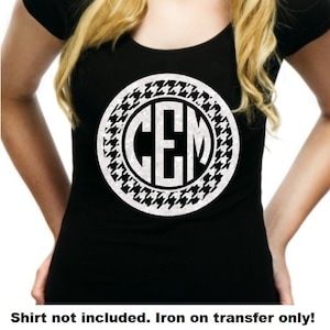 May include: White iron-on transfer with a black and white houndstooth pattern and the letters "CEM" in a circle.
