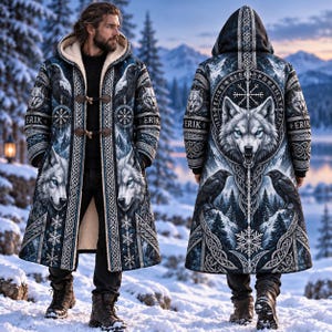 May include: A long, hooded coat featuring a dark blue and white print of wolves, ravens, snowflakes, and Norse-inspired patterns. The coat has a cream-colored fleece lining, toggle closures, and the name ERIK printed on the sleeves.
