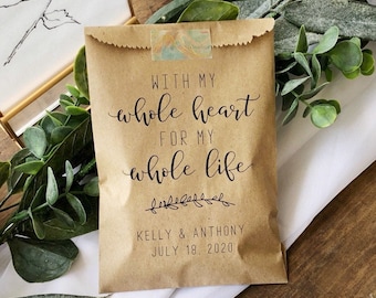 May include: A brown paper bag with the text "WITH MY whole heart FOR MY whole life" and a floral design. The bag also includes the names "KELLY & ANTHONY" and the date "JULY 18, 2020".