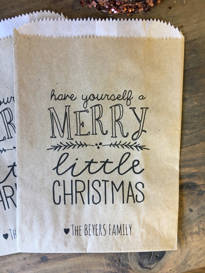 May include: Brown paper gift bag with the text "Have yourself a Merry little Christmas" and "The Beyers Family" printed on it.