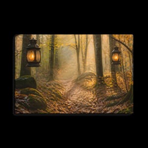 May include: A rectangular wall art print depicting a forest path covered in fallen autumn leaves. Two black metal lanterns with glowing warm yellow lights hang from tree branches on either side of the path, illuminating the misty woods.
