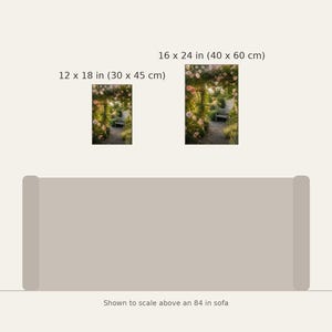 May include: Two rectangular wall art prints featuring a garden path with pink flowers and a bench. The smaller print is 12 x 18 inches and the larger is 16 x 24 inches. They are displayed above an 84 inch sofa for scale reference.