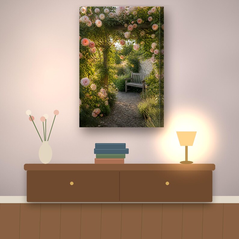 May include: A rectangular wall art print featuring a garden scene with a wooden bench positioned under an archway covered in blooming pale pink roses. The path is made of gravel and leads toward a stone wall in the background of the image.
