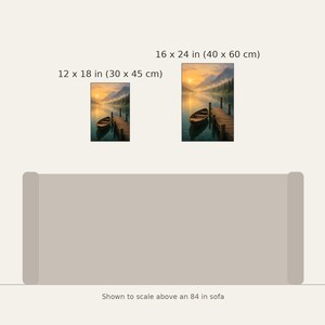 May include: Two vertical wall art prints depicting a lake scene with a wooden boat and pier at sunset. The prints are labeled with dimensions of 12 x 18 inches and 16 x 24 inches, shown to scale above an 84 inch sofa illustration.