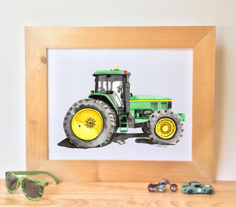 May include: A watercolor painting of a green tractor with yellow wheels. The tractor is framed in a light wood frame.