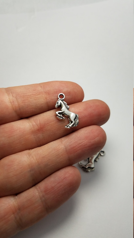 4 Horse charms antique silver tone A13