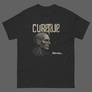 May include: A black short-sleeved t-shirt featuring a beige graphic of a human head with visible brain and nerve structures. The text CURETAJE is printed in a stylised font above the head, with the phrase É-la vita... printed below the chin.