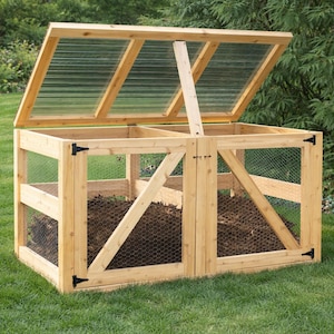 May include: A rectangular wooden compost bin featuring two front-opening doors with black metal hinges and a hinged, translucent corrugated plastic lid. The structure is framed in light-colored wood with wire mesh side panels and a central divider.