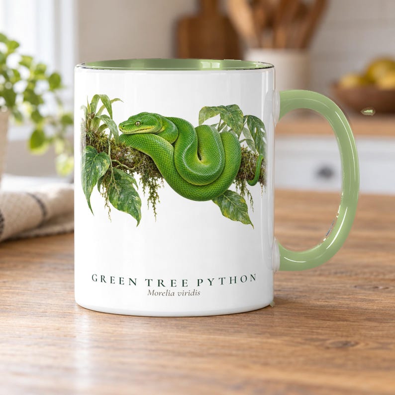 Green Tree Python coffee mug on an oak kitchen table in morning light