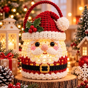May include: A crocheted Santa Claus basket featuring a red hat with a white pom-pom, a white brim, and green holly leaves with red berries. The body displays a white beard, a black belt with a yellow buckle, and a red handle for carrying.