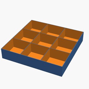 May include: A square storage tray with a dark blue exterior and nine individual compartments. The interior walls and base of each section are a bright orange colour, creating a high-contrast grid design for organising small items.