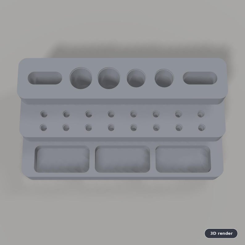 May include: A light gray tiered desk organizer featuring a top level with two elongated slots and four circular holes, a middle level with fourteen small circular holes, and a bottom level with three rectangular compartments.