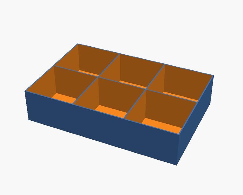 May include: A rectangular storage box featuring six individual compartments. The exterior walls of the box are a solid dark blue colour, while the interior walls and the base of each of the six sections are a contrasting bright orange colour.