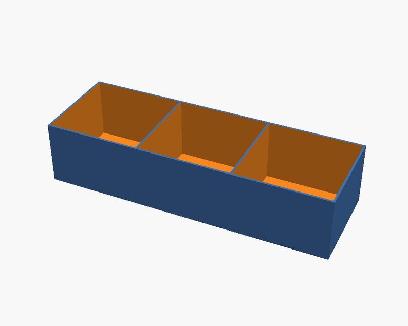 May include: A rectangular storage box with a dark blue exterior and a bright orange interior. The box is divided into three equal open compartments by two internal partitions, creating a structured organiser for various items.