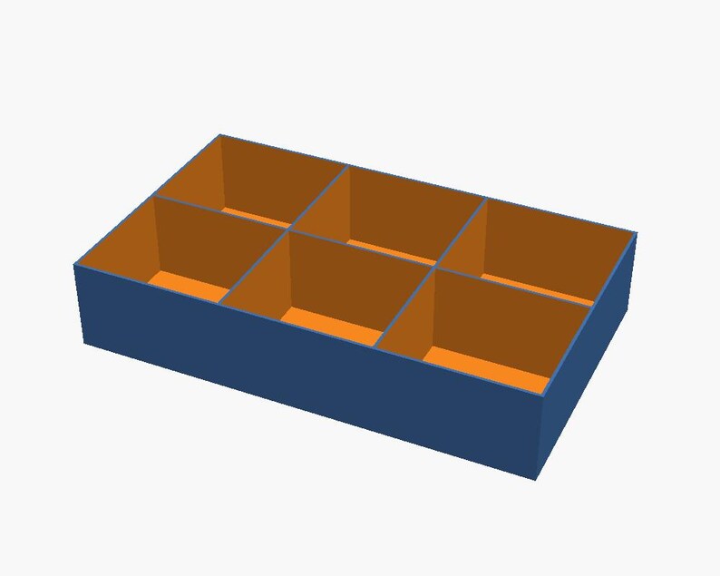 May include: A rectangular storage box with a dark blue exterior and a bright orange interior. The box is divided into six equal compartments by internal walls, creating a grid-like structure for organising small items within the container.