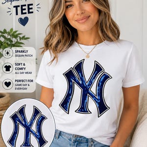 May include: A white short-sleeved t-shirt featuring a large blue sequin NY logo patch on the chest. The text Sequin Patch TEE is visible in the upper left corner, along with icons and text describing the shirt as sparkly, soft, and comfy.