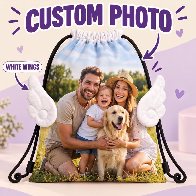 May include: A drawstring backpack featuring a custom photo of a family with a dog, adorned with plush white wings on the sides. The bag includes black drawstrings and displays the text CUSTOM PHOTO and WHITE WINGS in purple.