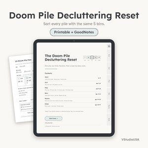 May include: A digital tablet displaying a Doom Pile Decluttering Reset guide with a table of contents, navigation tabs, and a start button. A secondary printable page titled 15-Minute Pile Pass is visible behind the tablet on a light background.
