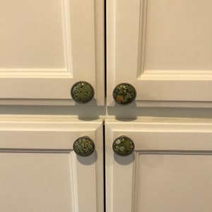 The luxury knobs are on pantry cabinets.