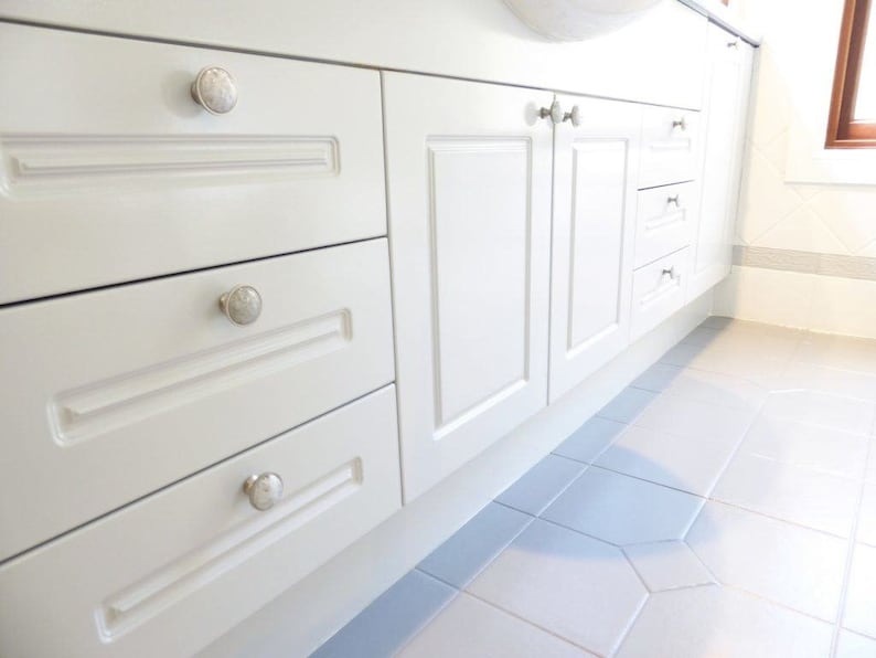 Custom made knobs in clear crystal were used by a designer in a bathroom renovation