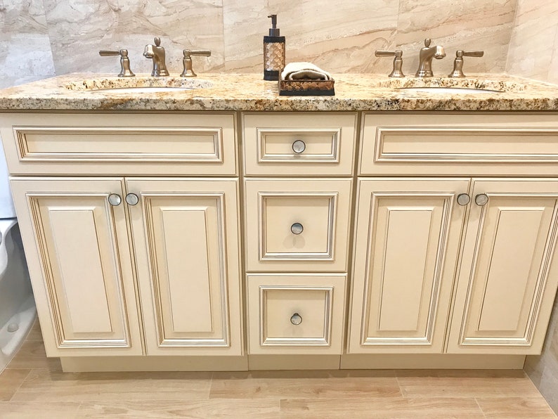 mother of pearl knobs are the finishing accent in the luxury bathroom by an interior decorator