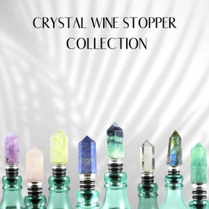 May include: A collection of crystal wine stoppers in various colours, including amethyst, rose quartz, citrine, lapis lazuli, clear quartz, labradorite, and fluorite. Each stopper is topped with a crystal point and has a silver metal base.