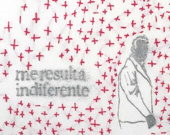 Dibujo negro y bordado rojo de hombre y frase sobre tela