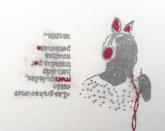 Black contemporary drawing, red embroidery and text on fabric