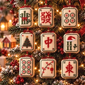 May include: Nine rectangular cross-stitch ornaments shaped like mahjong tiles, each featuring a unique design including a Christmas tree, a Santa hat, and various Chinese characters, all suspended by red ribbons with small bows.