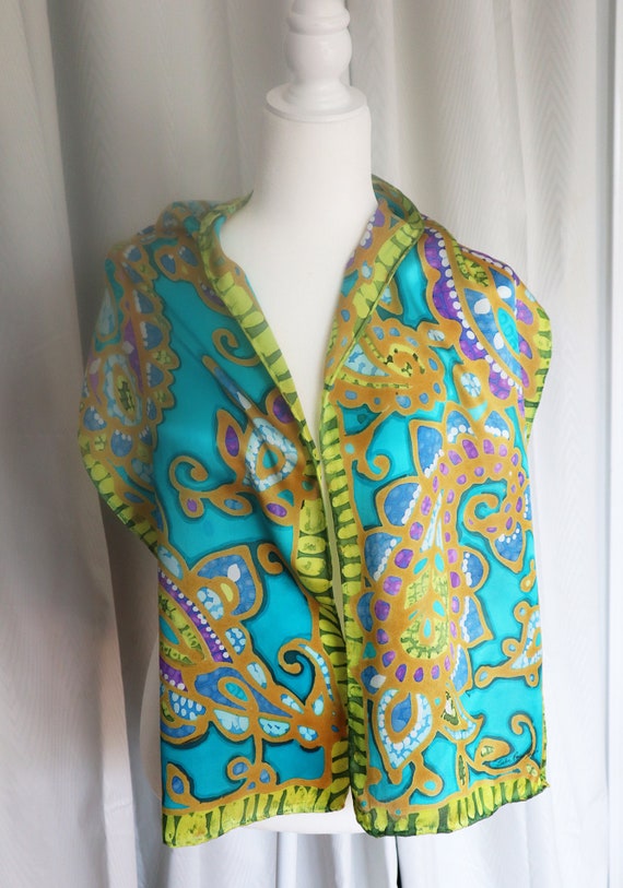 Hand painted silk satin oblong 11" x60" scarf of paisley in turquoise, gold and greens with a violet accent