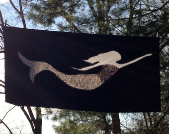 Blond mermaid on navy blue background