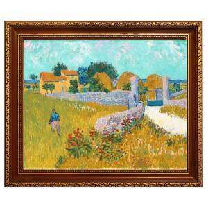 May include: A framed oil painting depicting a rural landscape with a yellow house, golden wheat fields, a stone wall, and a person walking. The scene features a light blue sky, green trees, and red flowers in the foreground, all enclosed in a dark brown ornate frame.