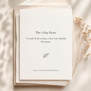 May include: A white rectangular card with dark grey text reading The 7-Day Reset, A Gentle Week to Pause, Clear Your Mind & Reconnect, and 7 Days • 7 Gentle Steps • One Fresh Start. A small black fern illustration sits in the centre.