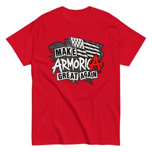 May include: A bright red short-sleeve t-shirt featuring a graphic print on the chest. The design includes a black and white flag with ermine spots, a red anarchy symbol, and the white text that reads MAKE ARMORICA GREAT AGAIN.