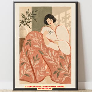 Puede incluir: Una lámina enmarcada con la ilustración de una persona de pelo oscuro sosteniendo una pequeña taza de té, envuelta en una manta de color terracota con un patrón de hojas blancas, junto a una planta, con el texto 2 ITEMS 30 OFF - 3 ITEMS 40 OFF DIGITAL OR PHYSICAL.