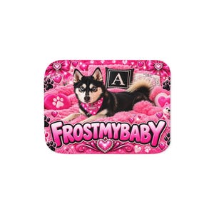 May include: A rectangular mat featuring a black and white husky wearing a pink bandana with the name FROST, lying on a bright pink fuzzy surface. The design includes pink hearts, paw prints, bows, and the text FROSTMYBABY in large pink letters.