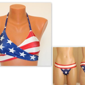 May include: A red, white, and blue bikini with a star pattern. The top is a halter style with a criss-cross design. The bottom is a high-cut style with a star pattern.